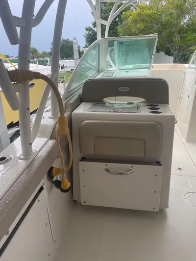  Yacht Photos Pics 2019 Sailfish 325 Dual Console boat interior with sink and storage.