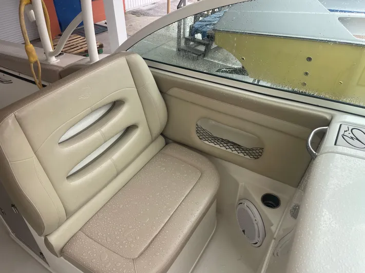  Yacht Photos Pics 2019 Sailfish 325 Dual Console boat interior with beige seating and speaker.