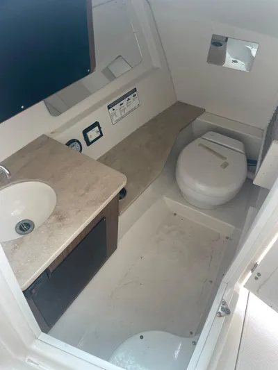  Yacht Photos Pics 2019 Sailfish 325 Dual Console boat bathroom with sink and toilet.