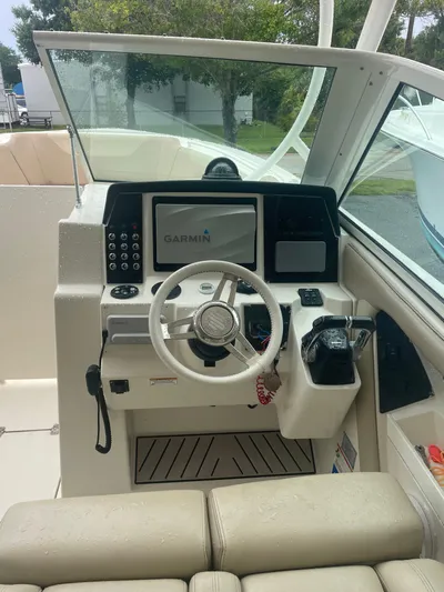  Yacht Photos Pics 2019 Sailfish 325 Dual Console boat cockpit with Garmin navigation system.