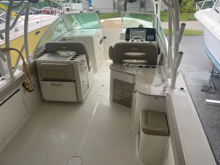 Yacht Photos Pics 2019 Sailfish 325 Dual Console boat interior with seating and control panel.