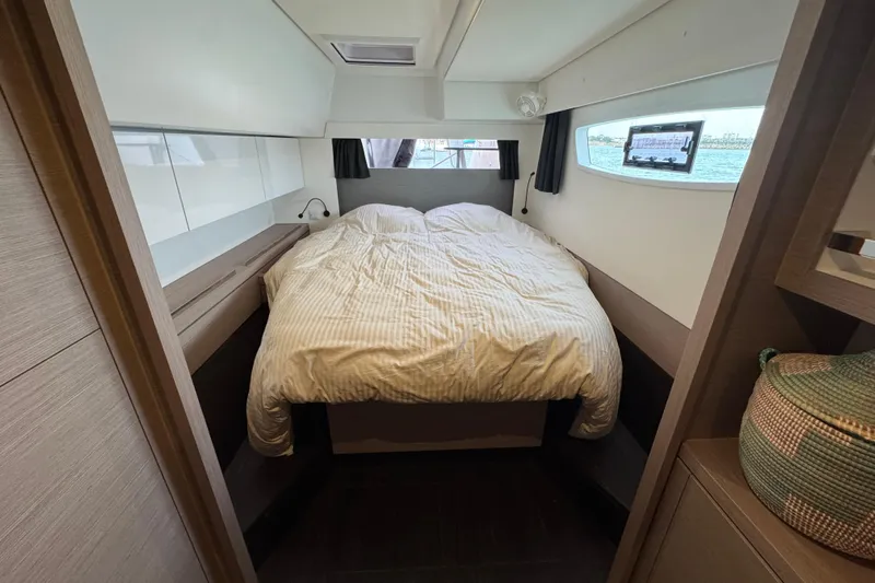 Lupa Di Mare Yacht Photos Pics Interior cabin of 2021 Fountaine Pajot Saona 47 catamaran with cozy bed and window view.