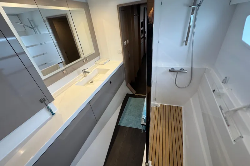 Lupa Di Mare Yacht Photos Pics Modern bathroom interior of 2021 Fountaine Pajot Saona 47 yacht, featuring sleek design and spacious shower.