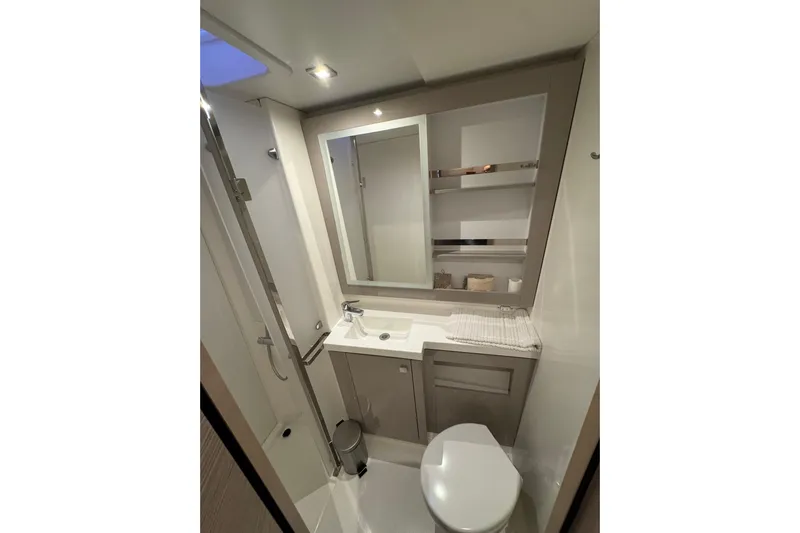 Lupa Di Mare Yacht Photos Pics Modern bathroom interior of 2021 Fountaine Pajot Saona 47 yacht, featuring sleek design and amenities.