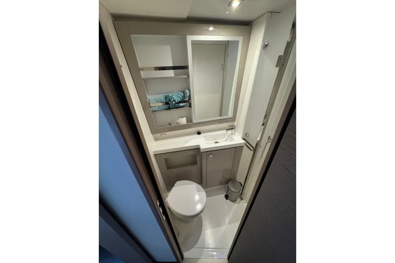 Lupa Di Mare Yacht Photos Pics Modern bathroom in 2021 Fountaine Pajot Saona 47 yacht, featuring sleek design and compact amenities.