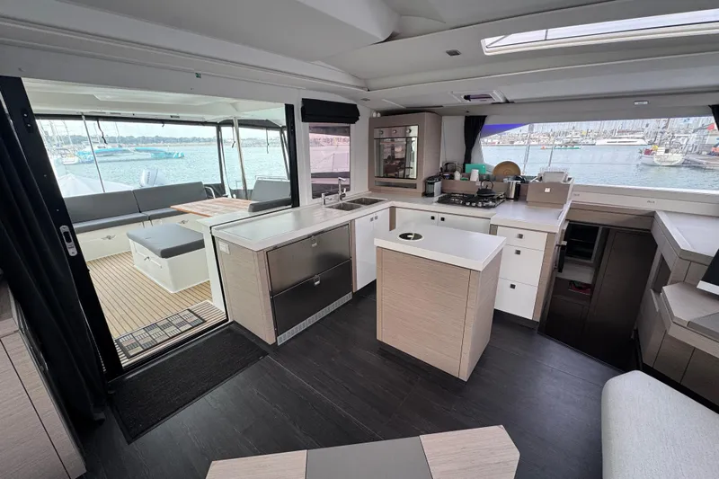 Lupa Di Mare Yacht Photos Pics Modern interior of 2021 Fountaine Pajot Saona 47 catamaran with spacious kitchen and seating area.