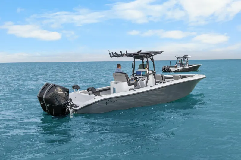  Yacht Photos Pics 2024 Yellowfin 26 Hybrid boat on open blue ocean under clear sky.