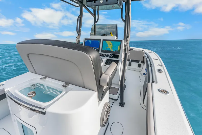  Yacht Photos Pics 2024 Yellowfin 26 Hybrid boat interior with navigation screens, ocean view.