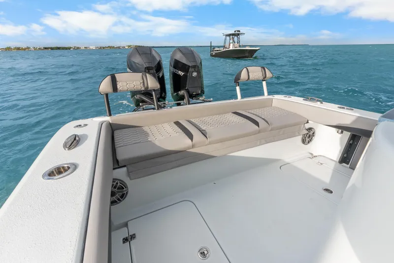  Yacht Photos Pics 2024 Yellowfin 26 Hybrid boat with dual Mercury engines on open water.