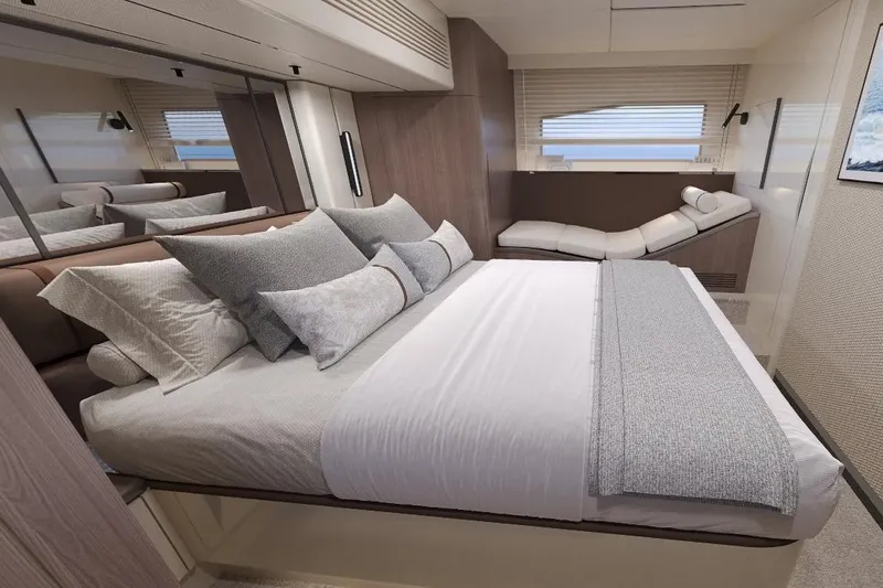  Yacht Photos Pics Luxurious bedroom interior of 2027 Galeon Yachts 520 FLY with elegant bedding and modern design.