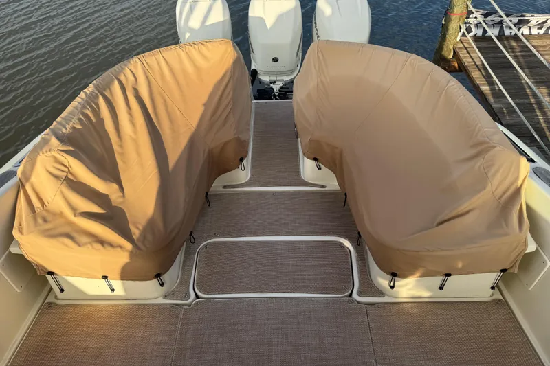 Yacht Photos Pics 2016 Chris-Craft Launch 36 boat with covered seating and twin engines at dock.