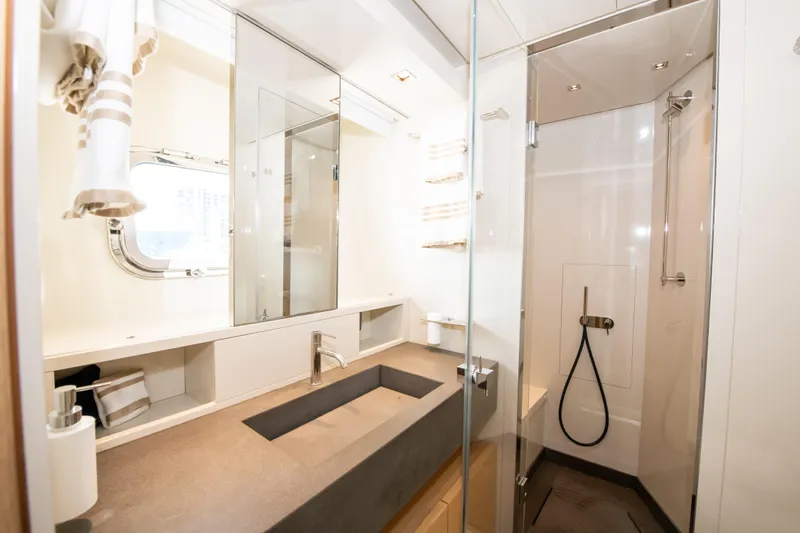 Seasun Yacht Photos Pics Luxurious bathroom on 2016 Sanlorenzo SL86 yacht with modern fixtures and glass shower.