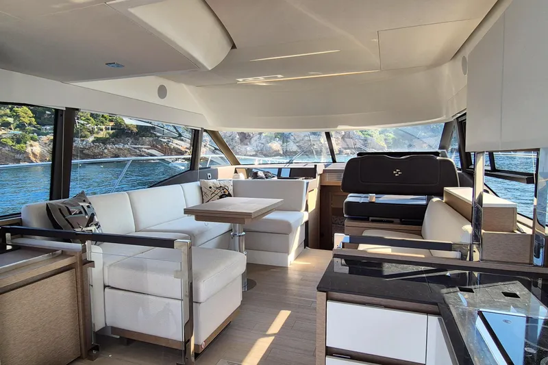 Ker Lann Yacht Photos Pics Luxurious interior of 2022 Prestige 460 yacht with modern seating and scenic ocean view.