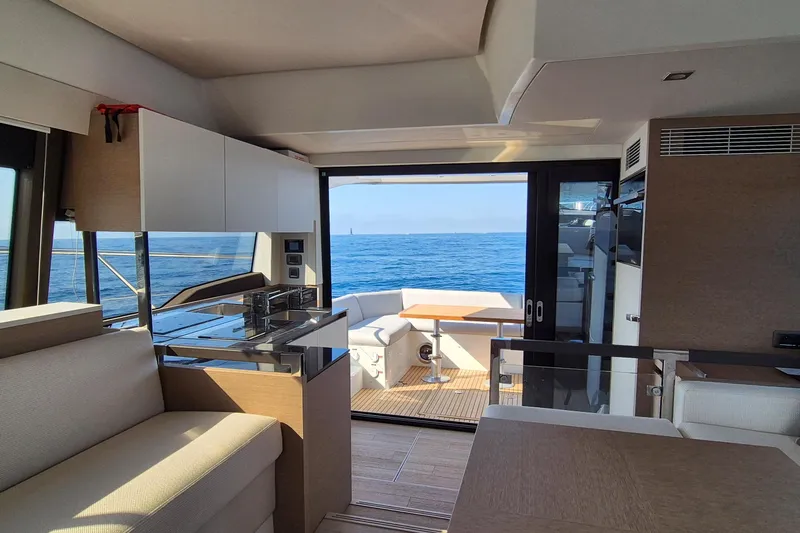 Ker Lann Yacht Photos Pics Interior view of 2022 Prestige 460 yacht with ocean backdrop.