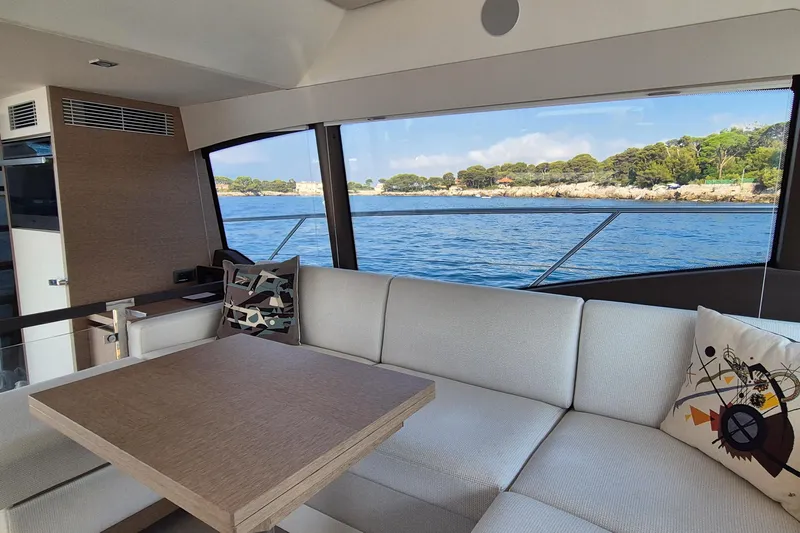 Ker Lann Yacht Photos Pics Interior of 2022 Prestige 460 yacht with ocean view through large windows.