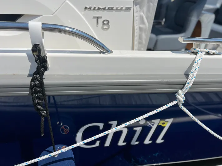 Chill Yacht Photos Pics Nimbus T8 boat with ropes and "Chill" text on the side, 2025 model.