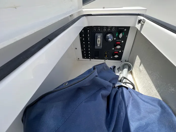 Chill Yacht Photos Pics Control panel and storage compartment in a 2025 Nimbus T8 boat.
