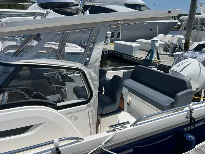 Chill Yacht Photos Pics Nimbus T8 2025 boat with sleek design, spacious seating, and modern cockpit at marina.