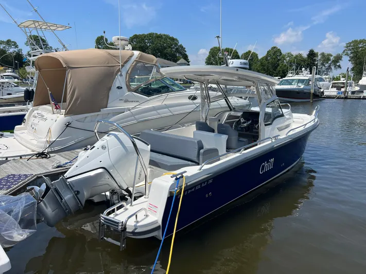 Chill Yacht Photos Pics Nimbus T8 2025 boat named "Chill" docked at a marina on a sunny day.