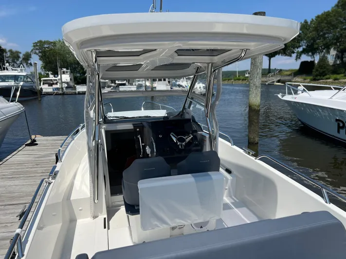 Chill Yacht Photos Pics Nimbus T8 2025 boat docked at marina, featuring sleek design and modern cockpit.