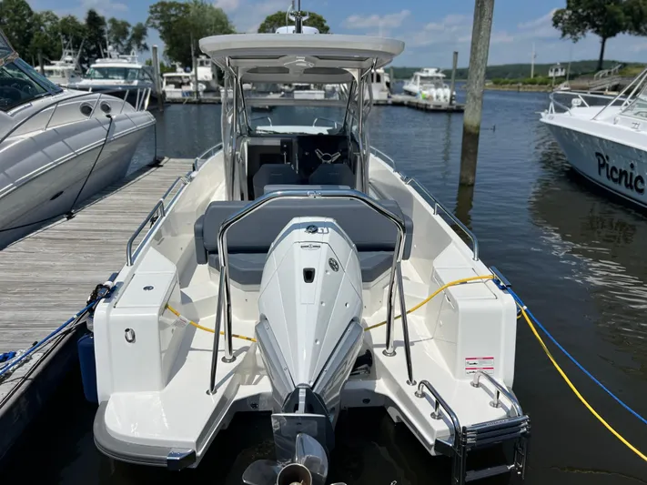 Chill Yacht Photos Pics 2025 Nimbus T8 boat docked at marina, featuring sleek design and modern amenities.