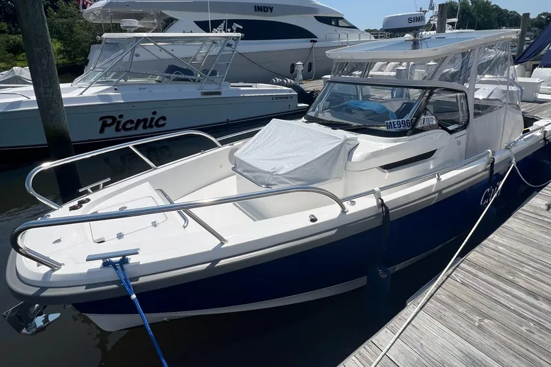 Chill Yacht Photos Pics 2025 Nimbus T8 boat docked at marina, featuring sleek design and modern amenities.