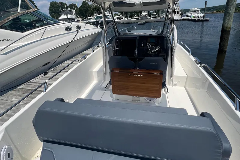 Chill Yacht Photos Pics 2025 Nimbus T8 boat interior with sleek design, docked at marina.