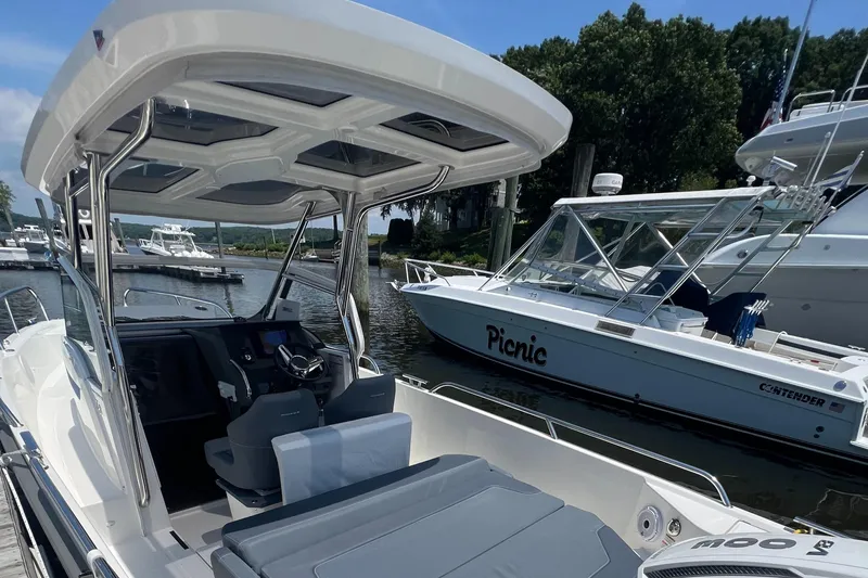 Chill Yacht Photos Pics 2025 Nimbus T8 boat docked at marina, featuring sleek design and modern cockpit.