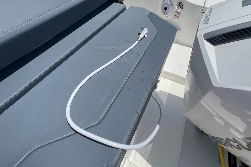 Chill Yacht Photos Pics Nimbus T8 2025 boat deck with hose and engine detail.