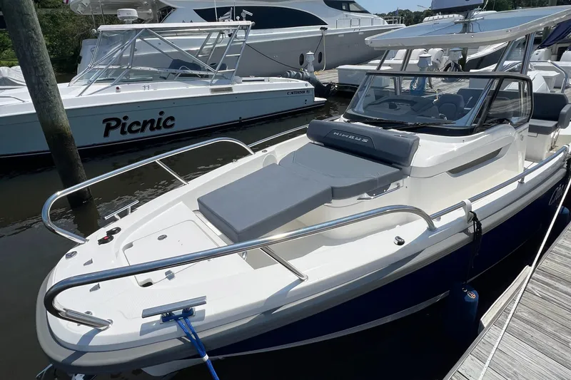 Chill Yacht Photos Pics Nimbus T8 2025 boat docked, featuring sleek design and spacious deck area.