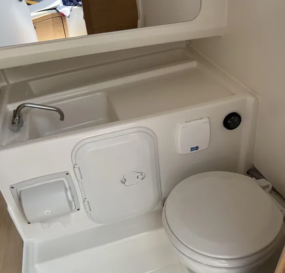 Chill Yacht Photos Pics Compact bathroom in 2025 Nimbus T8, featuring sink and toilet.