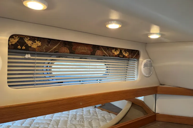Interim Yacht Photos Pics 2001 Bayliner 4087 Aft Cabin Motoryacht interior with window blinds and recessed lighting.