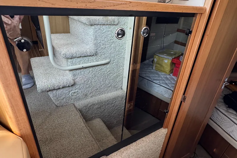 Interim Yacht Photos Pics Interior of 2001 Bayliner 4087 Aft Cabin Motoryacht with carpeted stairs and cozy cabin.