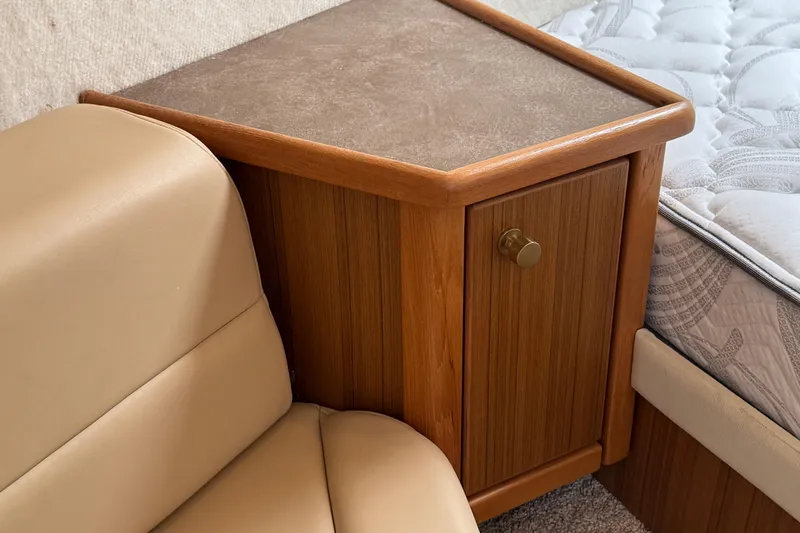 Interim Yacht Photos Pics 2001 Bayliner 4087 Aft Cabin Motoryacht interior with wooden cabinet and beige seating.
