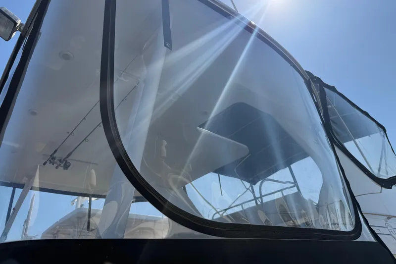 Interim Yacht Photos Pics 2001 Bayliner 4087 Aft Cabin Motoryacht with sunlit windows and sleek design.