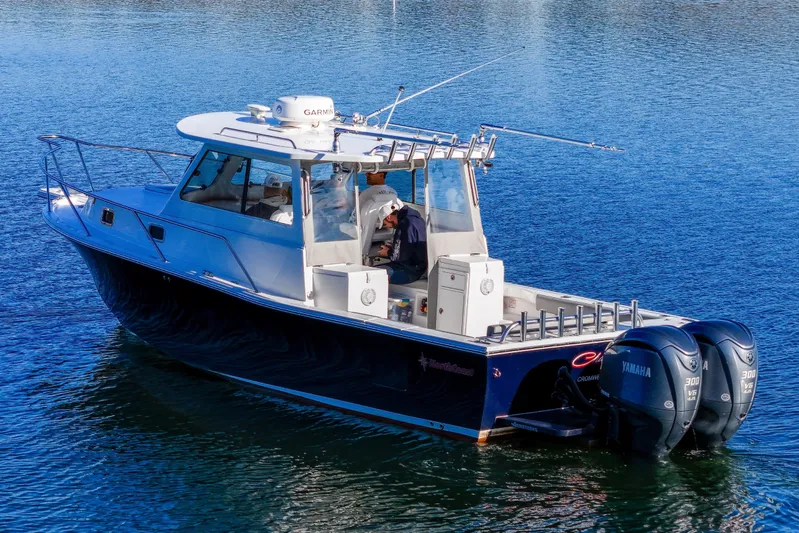 Challenger Yacht Photos Pics 2021 NorthCoast 315 HT boat on water with dual Yamaha engines.