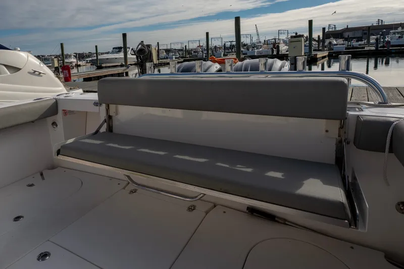 Challenger Yacht Photos Pics 2021 NorthCoast 315 HT boat with gray seating at a marina dock.