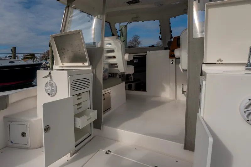 Challenger Yacht Photos Pics 2021 NorthCoast 315 HT boat interior with open storage compartments and seating.