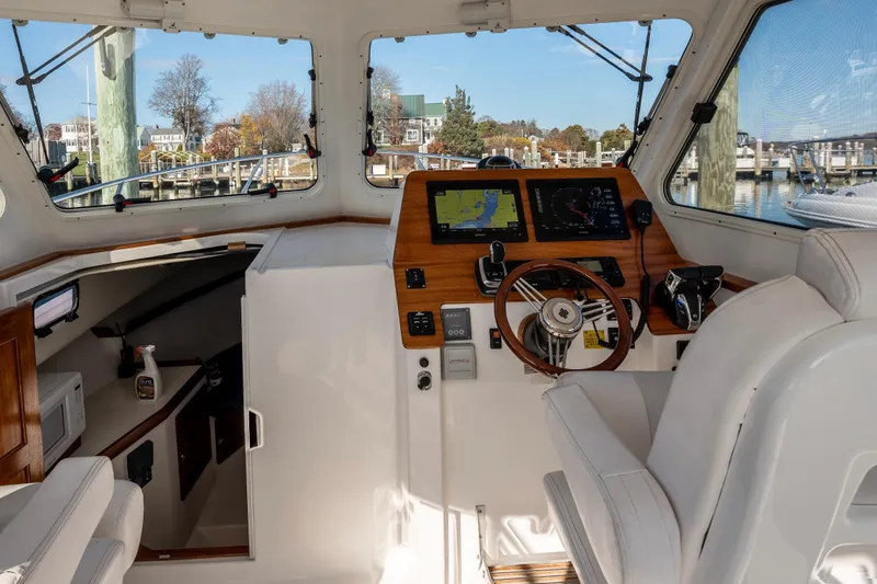 Challenger Yacht Photos Pics Interior of 2021 NorthCoast 315 HT boat with modern navigation equipment.