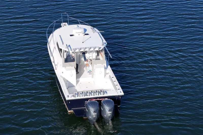 Challenger Yacht Photos Pics 2021 NorthCoast 315 HT boat with dual engines on calm water.