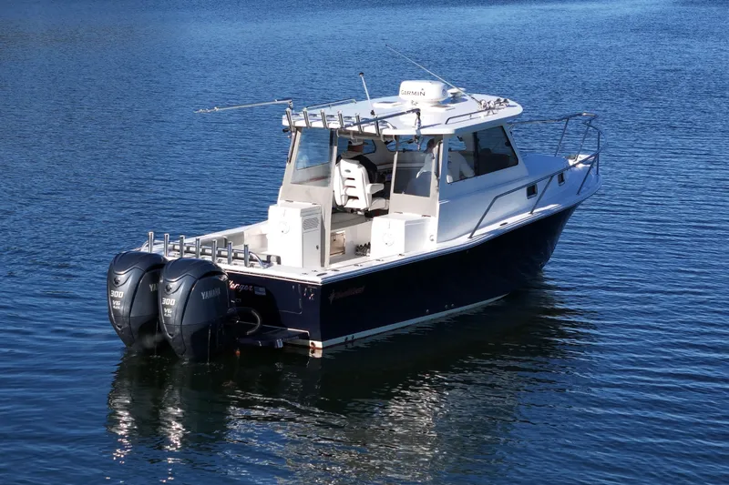 Challenger Yacht Photos Pics 2021 NorthCoast 315 HT boat with dual Yamaha engines on calm water.
