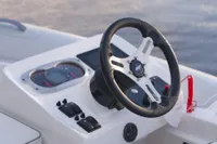 Steering console of 2023 AB Inflatables 350 XP boat with modern controls.