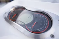 Close-up of 2023 AB Inflatables 350 XP boat dashboard with gauges.