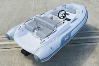2023 AB Inflatables 350 XP boat on concrete surface, featuring sleek design and modern controls.