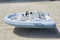 2023 AB Inflatables 350 XP boat on concrete surface, featuring sleek design and modern seating.
