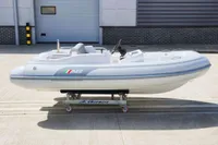 2023 AB Inflatables 350 XP boat on a wheeled platform, outdoor setting.