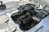 Engine compartment of 2023 AB Inflatables 350 XP boat, showcasing detailed mechanical components.