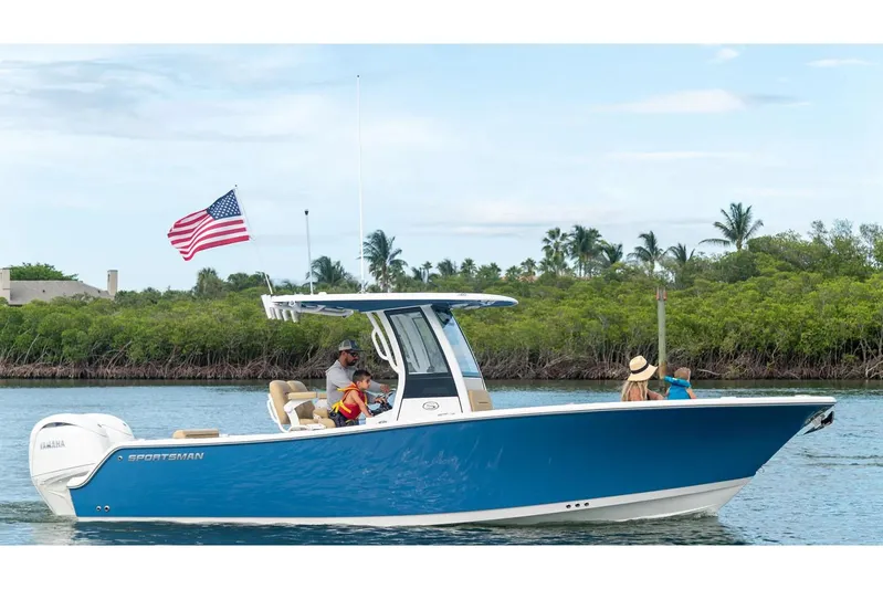  Yacht Photos Pics Manufacturer Provided Image: 2025 Sportsman Open 252 Center Console boat cruising with passengers, American flag waving.