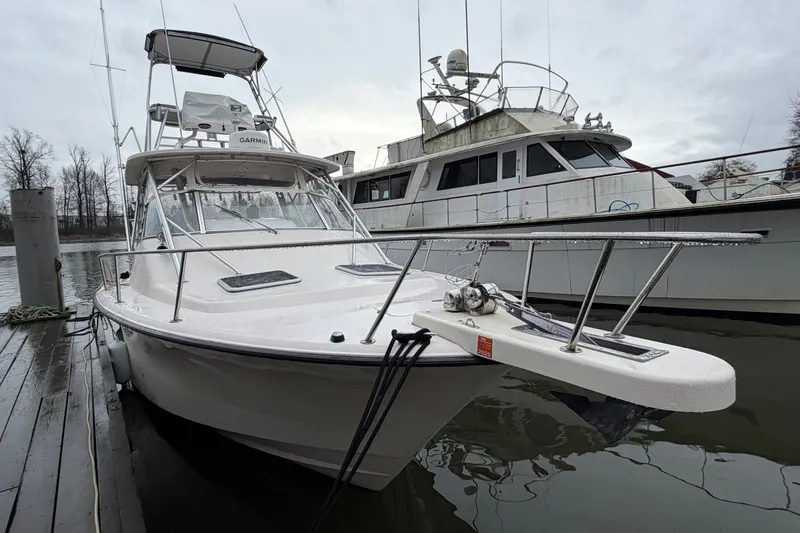  Yacht Photos Pics 2004 Grady-White Express 330 boat docked on a cloudy day.