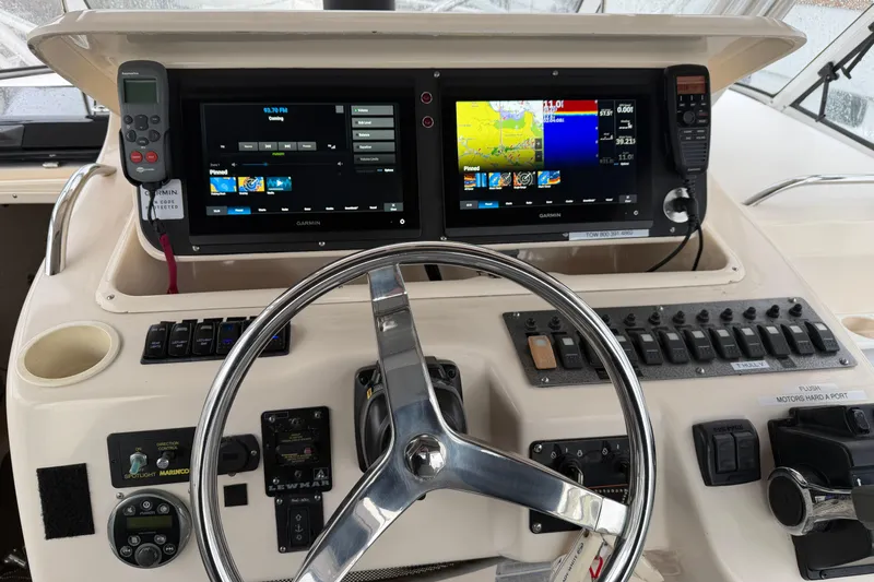  Yacht Photos Pics 2004 Grady-White Express 330 helm with Garmin navigation displays and control panel.